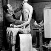 Henry Moore in his studio at Much Hadham, Hertfordshire, working on King and Queen, 195