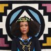 dress From Somewhere, necklace and head piece Pichulik, rug African textiles from The Ninevites